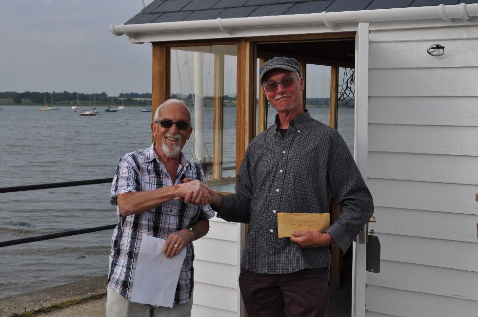Alan Hodgeson receives prize for biggest bass